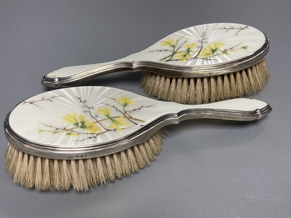 A 1950s silver and enamel five piece mirror and brush set, S.J Rose & Son, London, 1954.